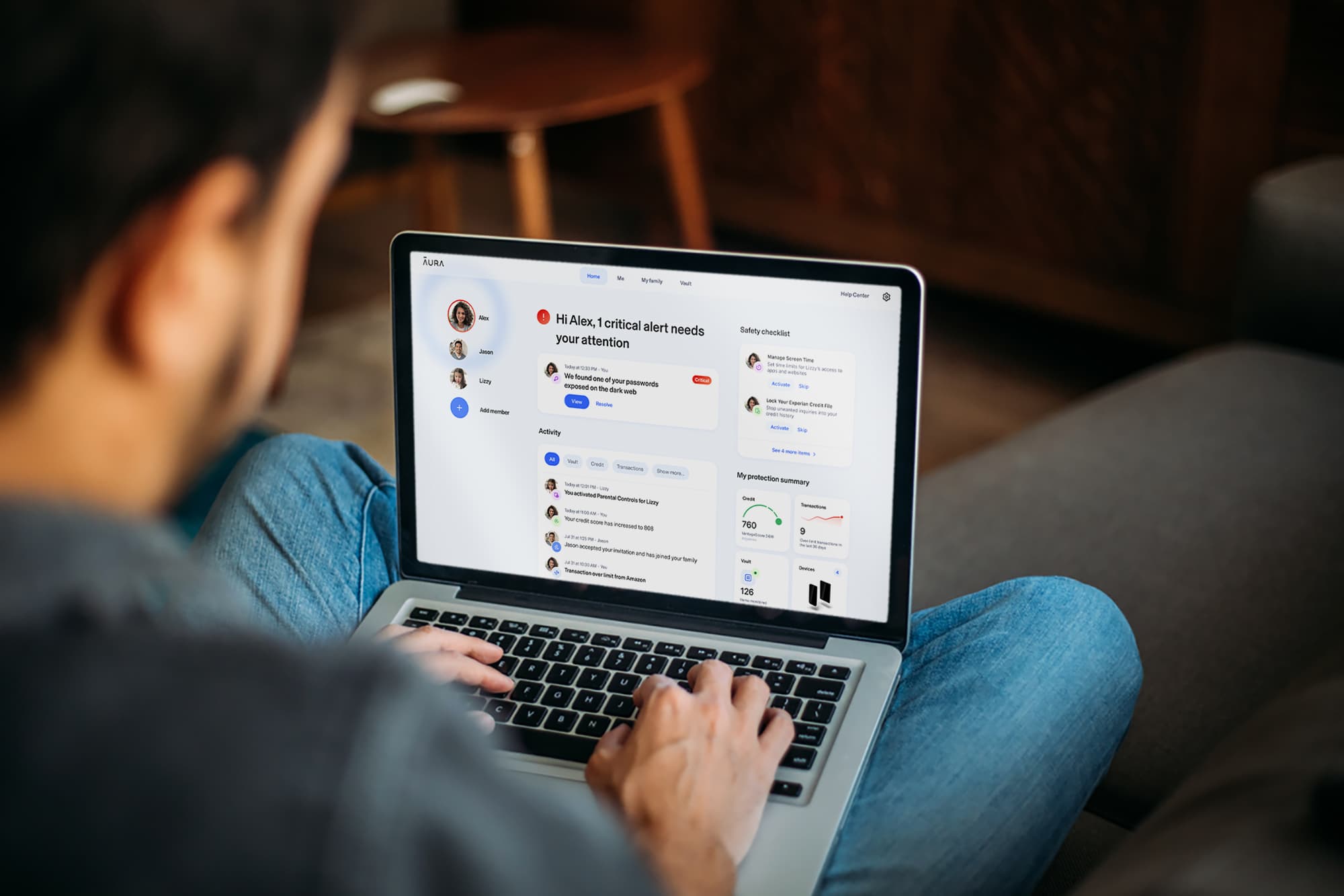 Man using Aura identity protection on laptop